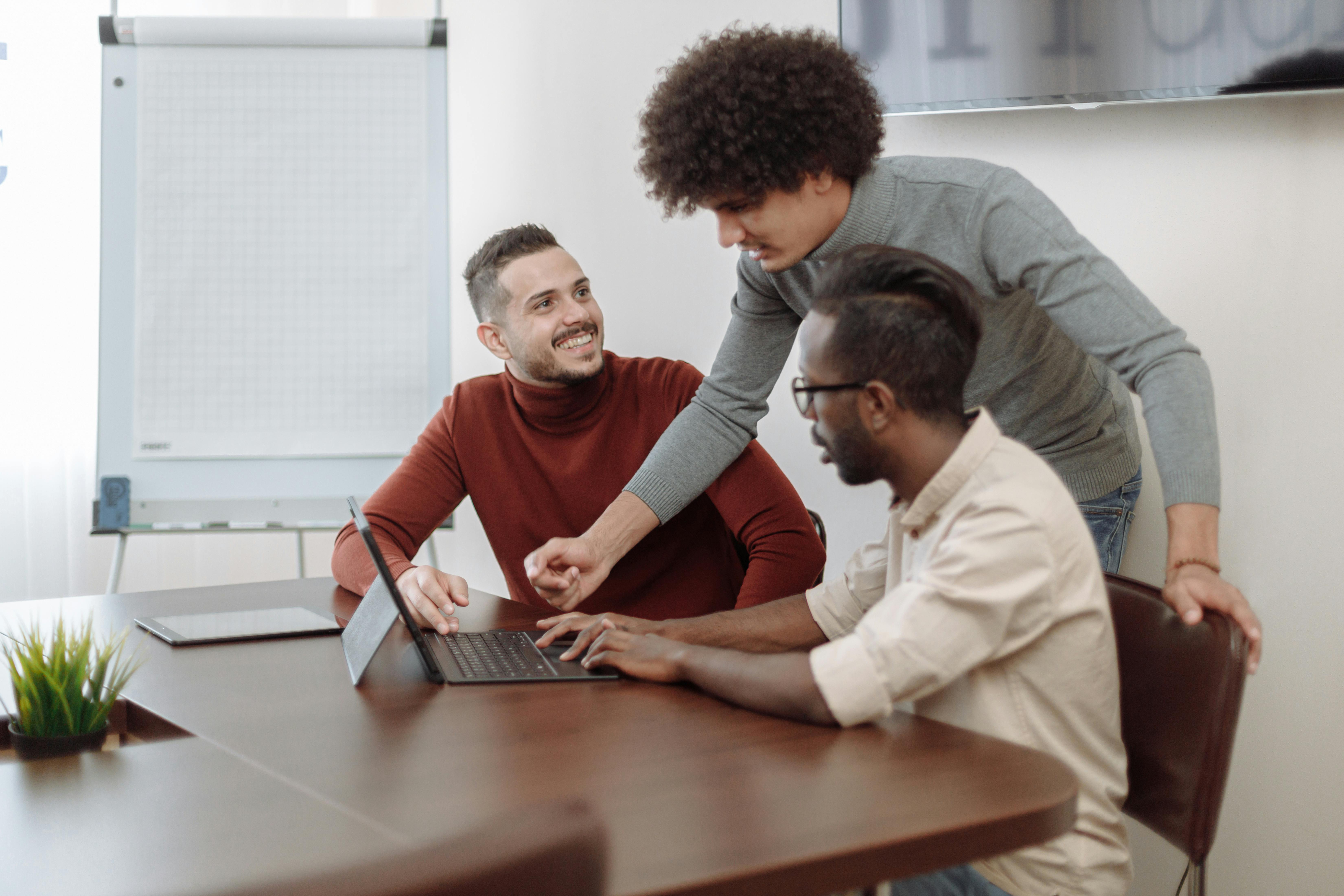 Professionals discussing a project together in a modern office