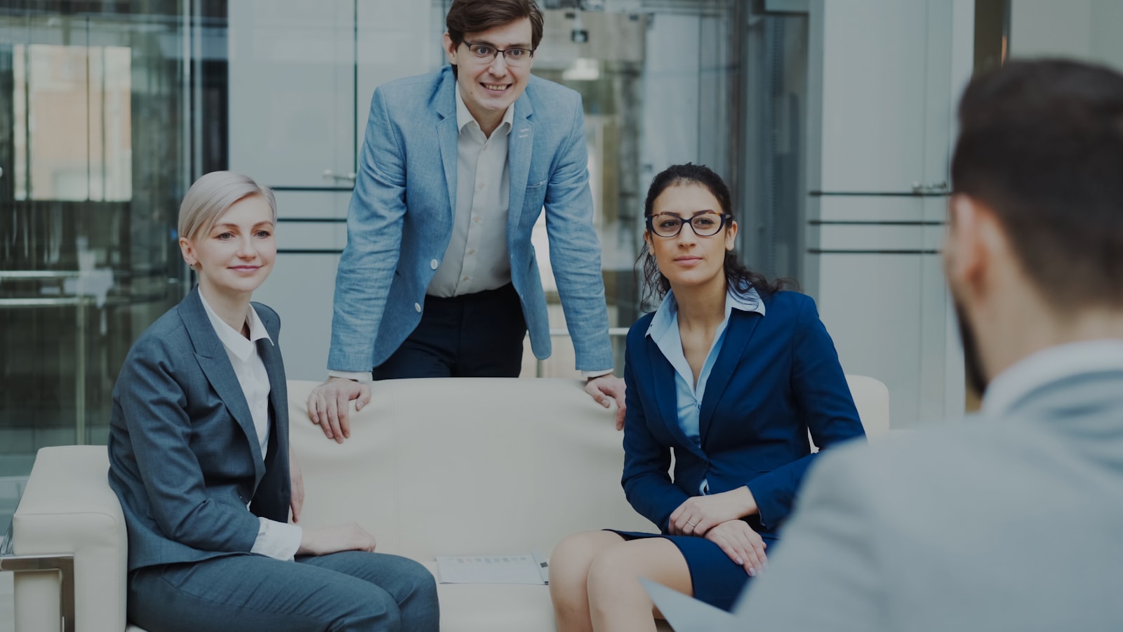 Professionals discussing a project together during a client meeting